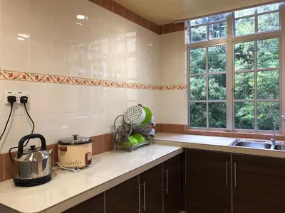 a kitchen with a sink and a counter top at BRINCHANG CENTRE 3 ROOMS APARTMENT in Cameron Highlands