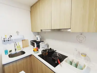 a kitchen with a sink and a counter top at Tropicana 218 Macalister at Georgetown 2Carparks in George Town