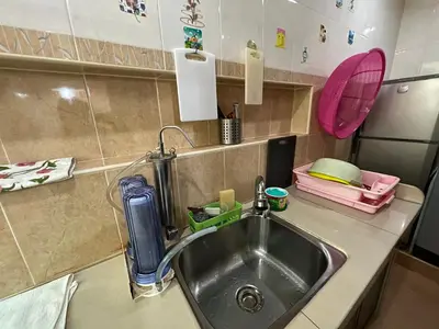 a kitchen counter with a sink and a sink at MAGICAL HOMESTAY CAMERON HIGHLANDS in Cameron Highlands