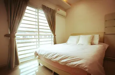 a bedroom with a bed and a large window at Cozy Suite for 2-6 pax near Kek Lok Si, Penang Hill, Sunshine Central in Ayer Itam