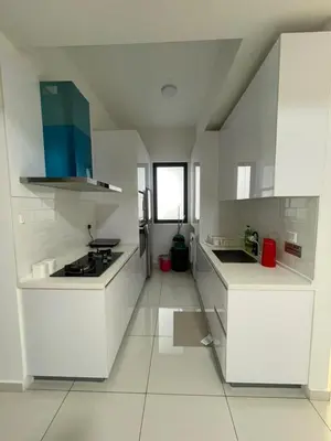 a white kitchen with white cabinets and a window at New Georgetown Stylist 2BR Homestay for 10pax \u65e0\u654c\u7f8e\u666f\u4e24\u623f\u6c11\u5bbf Beacon Executive Suite in George Town
