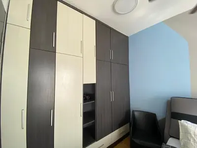a bedroom with black and white cabinets and a bed at Dual Key 3BR at Macalister 218 Georgetown 32 WL in George Town