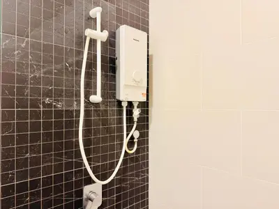 a shower in a bathroom with black tiles at N New Georgetown Instagramable 2BR Homestay for 10pax \u65e0\u654c\u7f8e\u666f\u4e24\u623f\u6c11\u5bbf Beacon Executive Suite in George Town
