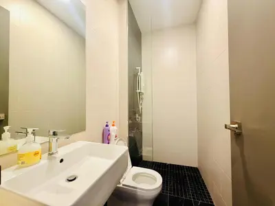 a white bathroom with a sink and a toilet at N New Georgetown Instagramable 2BR Homestay for 10pax \u65e0\u654c\u7f8e\u666f\u4e24\u623f\u6c11\u5bbf Beacon Executive Suite in George Town