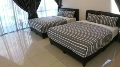 two beds sitting in a room with windows at HOMESTAY CAMERON HIGHLANDS GOLDEN HILL 5BR SEMI D GOLDEN HILLS NIGHT Market NO BBQ in Brinchang
