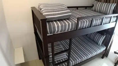 two bunk beds in a small room with at HOMESTAY CAMERON HIGHLANDS GOLDEN HILL 5BR SEMI D GOLDEN HILLS NIGHT Market NO BBQ in Brinchang