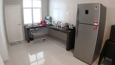 a kitchen with a stainless steel refrigerator and a counter at HOMESTAY CAMERON HIGHLANDS GOLDEN HILL 5BR SEMI D GOLDEN HILLS NIGHT Market NO BBQ in Brinchang