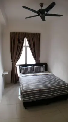 a bed in a room with a ceiling fan at HOMESTAY CAMERON HIGHLANDS GOLDEN HILL 5BR SEMI D GOLDEN HILLS NIGHT Market NO BBQ in Brinchang
