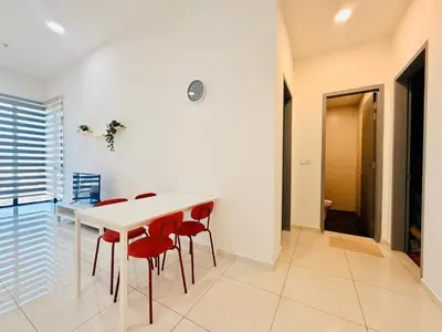 a dining room with a white table and red chairs at New Georgetown Modern City View 2BR Homestay for 10pax \u65e0\u654c\u7f8e\u666f\u4e24\u623f\u6c11\u5bbf Beacon Executive Suite in George Town