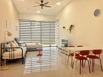 a hospital room with a bed and a table and chairs at New Georgetown Modern City View 2BR Homestay for 10pax \u65e0\u654c\u7f8e\u666f\u4e24\u623f\u6c11\u5bbf Beacon Executive Suite in George Town