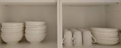 a group of white vases sitting on a shelf at New Georgetown Modern City View 2BR Homestay for 10pax \u65e0\u654c\u7f8e\u666f\u4e24\u623f\u6c11\u5bbf Beacon Executive Suite in George Town