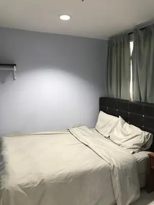 a bedroom with a bed with white sheets and a window at Pangkor Coralbay Resort Room 208 apartment in Pangkor