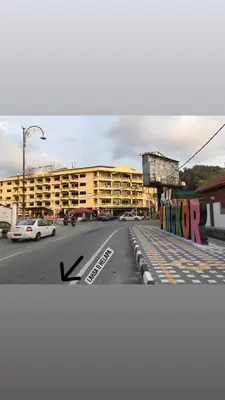 an empty street in front of a large building at Pangkor Coralbay Resort Room 208 apartment in Pangkor