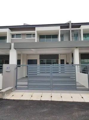 a building with a blue fence in front of it at Yong Guesthouse in Kuala Kangsar