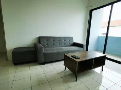 a living room with a couch and a coffee table at Happy homestay pulau pangkor in Kampong Sungai Udang