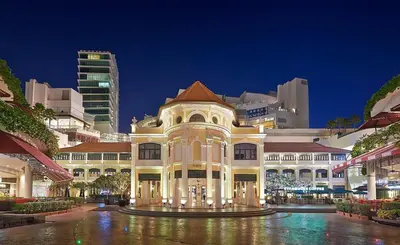a large building in a city at night at EE's Beach House - Homestay 3 min walk to beach in Batu Ferringhi
