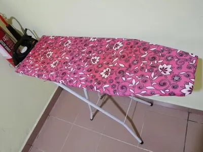 a pink umbrella sitting on top of a table at Evonne Budget Hotel in Tanah Rata
