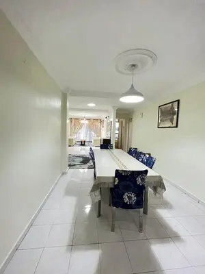 a dining room with a table and chairs at Azzalea 3-Bedroom Apartment Cameron Highlands in Tanah Rata