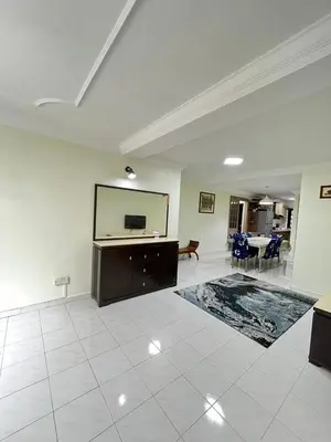 a large living room with a large mirror on the wall at Azzalea 3-Bedroom Apartment Cameron Highlands in Tanah Rata