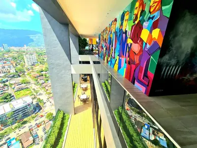 a building with a large painting on the side of it at Beacon Executive Suites - George Town in George Town
