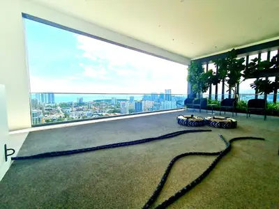 a room with a large window with a view of a city at Beacon Executive Suites - George Town in George Town