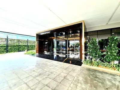 an external view of a building with plants at Beacon Executive Suites - George Town in George Town