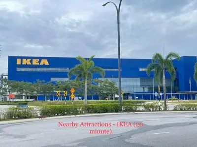 a kera building with palm trees in front of a street at Entire 33 Cozy House • 3 Bedroom @ Alma Bukit Mertajam in Bukit Mertajam