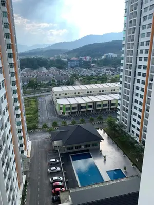 an aerial view of a building with a swimming pool at Ammar SkyHome Ipoh in Ipoh