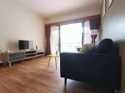 a living room with a couch and a large window at Cozy Home Copthorne Equatorial Hill Resort in Brinchang