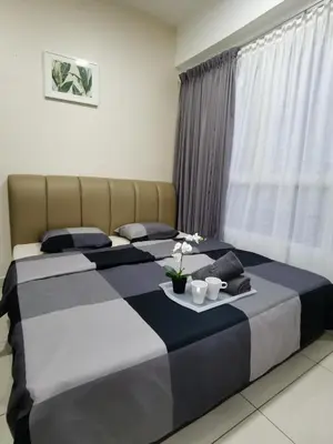 a bedroom with two beds and a table with two cups at ●T11●2Pax●Studio●5min●Queensbay●Pg Bridge View● in Bayan Lepas