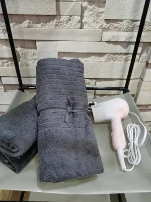 a pair of towels on a table with a wii controller at ●T11●2Pax●Studio●5min●Queensbay●Pg Bridge View● in Bayan Lepas