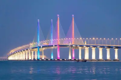 a bridge over the water at night with colorful lights at ●T11●2Pax●Studio●5min●Queensbay●Pg Bridge View● in Bayan Lepas