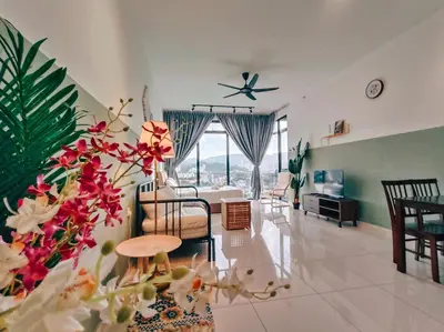 a living room with a couch and a table at Beacon Suites with Infinity Pool at Georgetown by WL in George Town