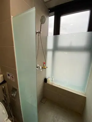 a bathroom with a shower with a window and a sink at Homestay at Macalister 218 Georgetown by WL in George Town