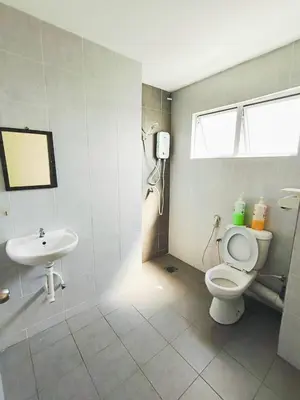 a bathroom with a toilet and a sink at The Venus Sri Manjung Block B High Floor in Seri Manjung