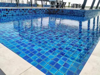 a swimming pool with blue tiles on it at The Venus Sri Manjung Block B High Floor in Seri Manjung