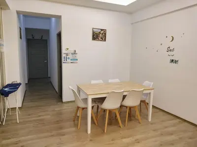 a dining room with a table and white chairs at The Venus Sri Manjung Block B High Floor in Seri Manjung