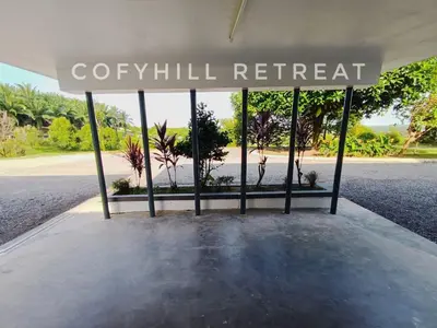 a sign that reads cyrill retreat in a pavilion at CofyHill Retreat in Kampong Changkat Tualang