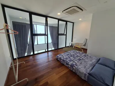 a bedroom with a bed and a floor to ceiling window at Sunrise Gurney Executive Premium Suite in George Town