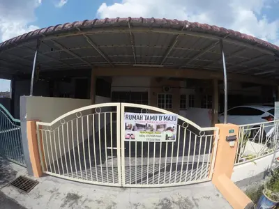 a gate in front of a house with a sign on it at Homestay Bidor DMaju in Bidur