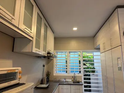 a kitchen with a sink and a window at Gerard's Place Nature Heaven Apartment in Tanah Rata