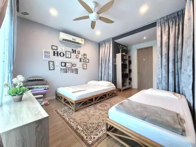 a bedroom with two beds and a ceiling fan at FERRINGHI RESORT 5-BEDROOM with POOL, BBQ SET, WiFi, Netflix & WALK to BEACH in Batu Ferringhi