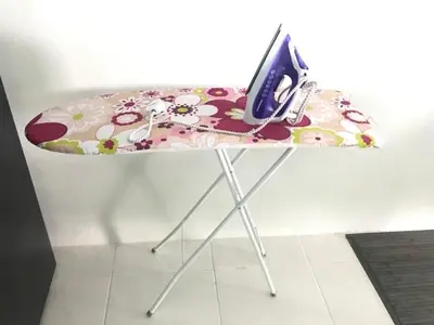 a table with a phone sitting on top of it at Chempaka Homestay (Near to UTP UiTM Seri Iskandar) in Seri Iskandar