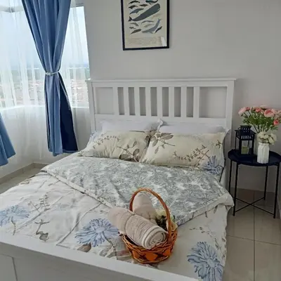 a bedroom with a bed with a basket on it at SCANDI HOMESTAY IPOH muslem in Ipoh