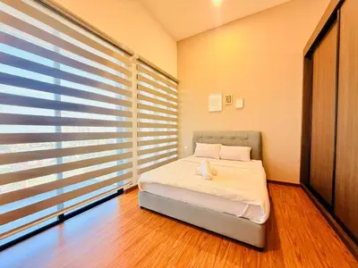 a bedroom with a bed and a large window at 2BR Luxury Rooftop Swimming Pool Beacon Georgetown10pax \u65e0\u654c\u7f8e\u666f\u4e24\u623f\u6c11\u5bbf in George Town