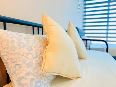 three pillows sitting on top of a bed at 2BR Luxury Rooftop Swimming Pool Beacon Georgetown10pax \u65e0\u654c\u7f8e\u666f\u4e24\u623f\u6c11\u5bbf in George Town