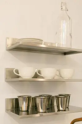 a shelf with bowls and cups on it at Central Georgetown - Loft House in George Town