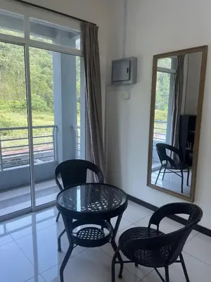 a table and chairs in a room with a mirror at LOW SEASON PROMOTION! Mountainview Corner Lot 10 pax in Ipoh