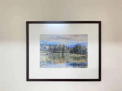 a framed painting of a lake on a wall at Spacious cozy Lakeville homestay 4 bedrooms all with AirCond in Seri Iskandar