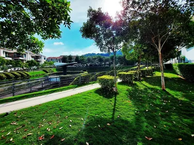 a park with green grass and trees and a sidewalk at ●STG12●3-Storey●Private House●2step Access Garden● in Bayan Lepas